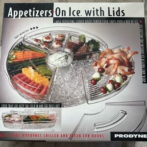 This revolving serving tray keeps appetizers chilled by ice